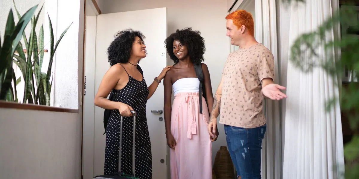 Host welcome guests at an Airbnb