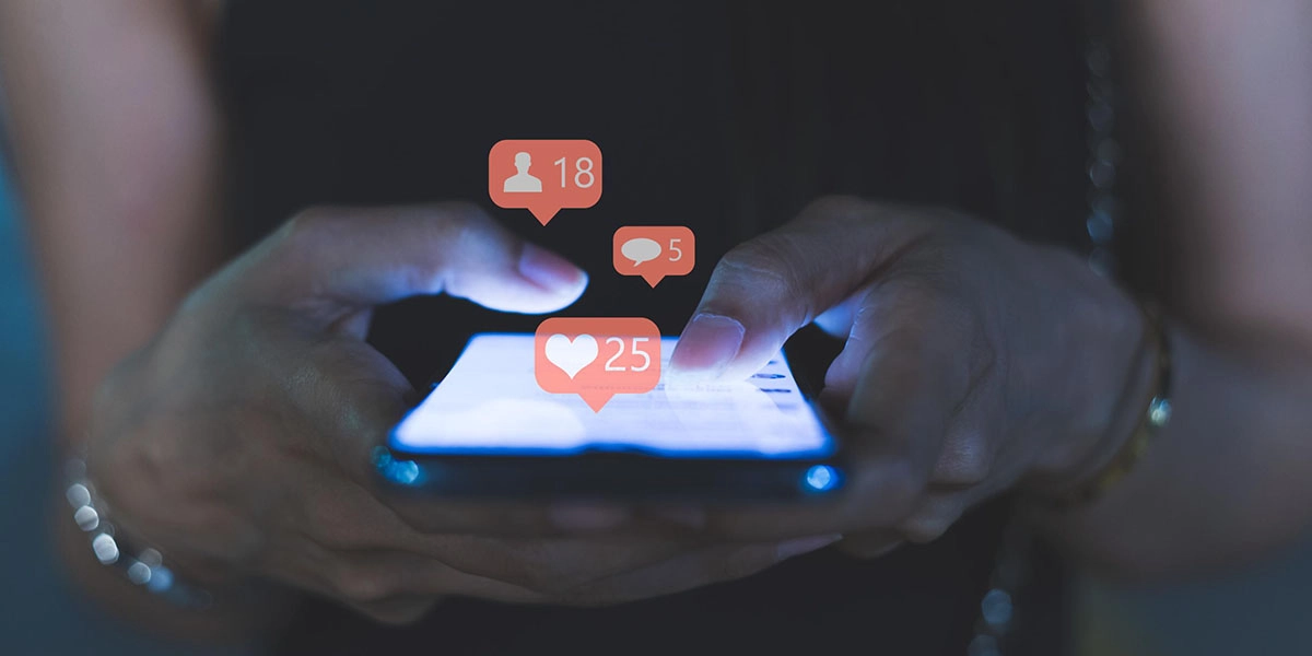 Young women use the phone to communicate at dusk, Social media concept