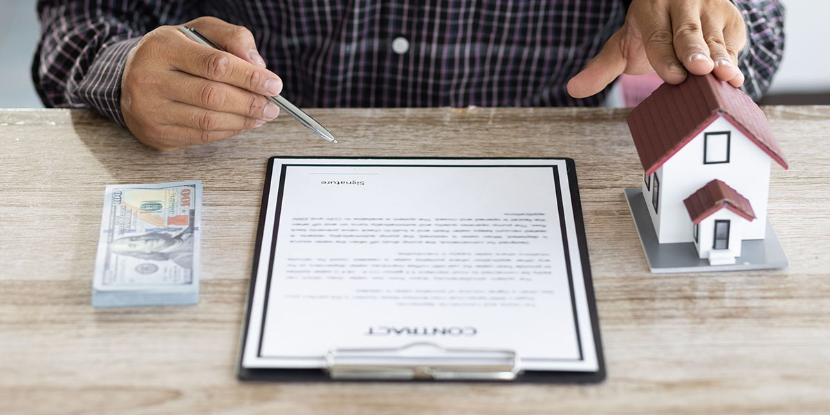 Real estate loan and mortgage contract agreement signing concept.