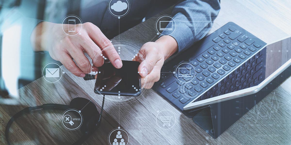 man hand using VOIP headset with digital tablet computer docking keyboard