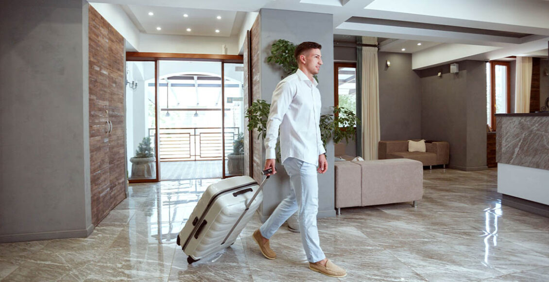 man at hotel reception