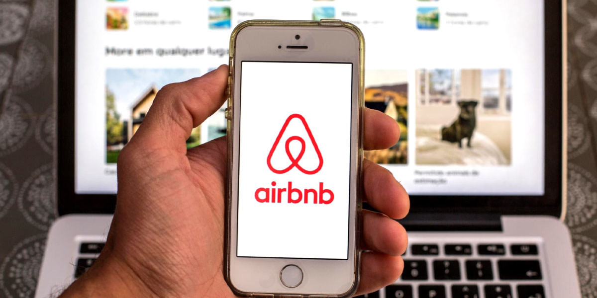 Airbnb logo on an Iphone screen