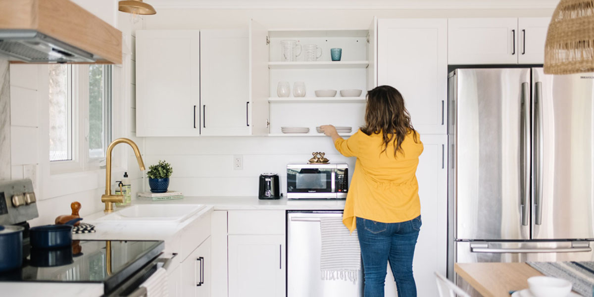 a woman organizing her kitchen