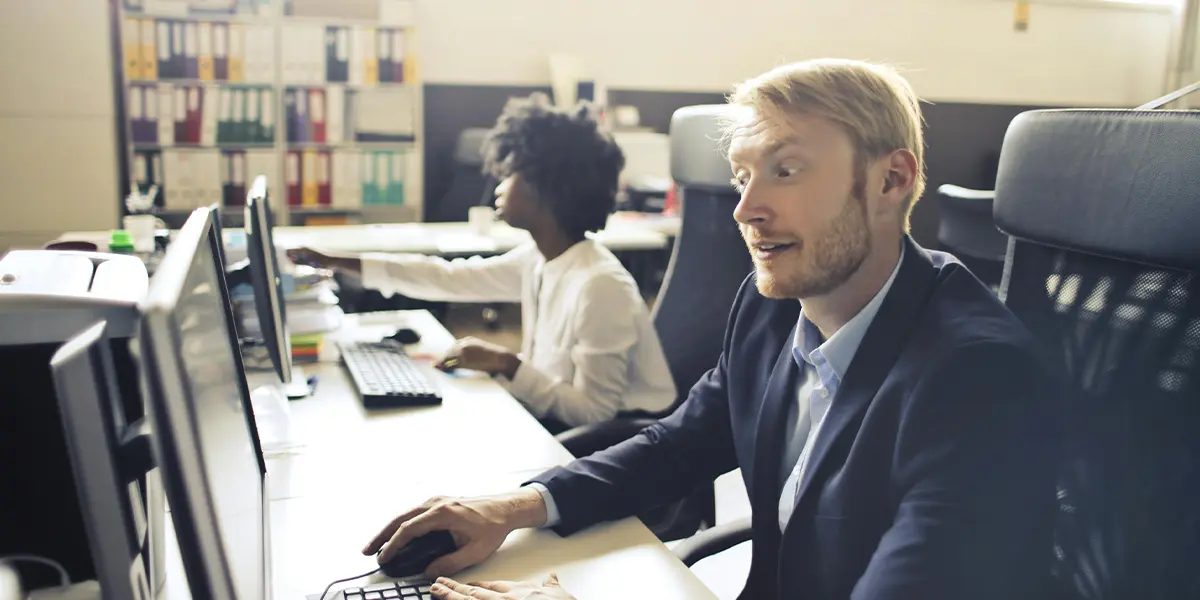 surprised executive man using computer